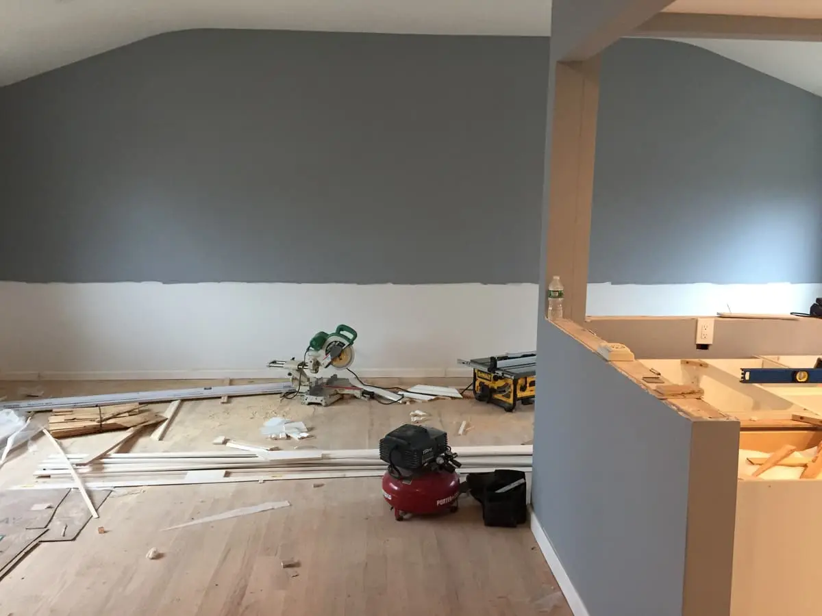 Selling estate property as an executor in Amityville: living room mid-renovation with saws and fresh paint